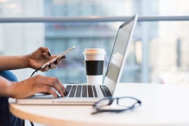 laptop and coffee on table